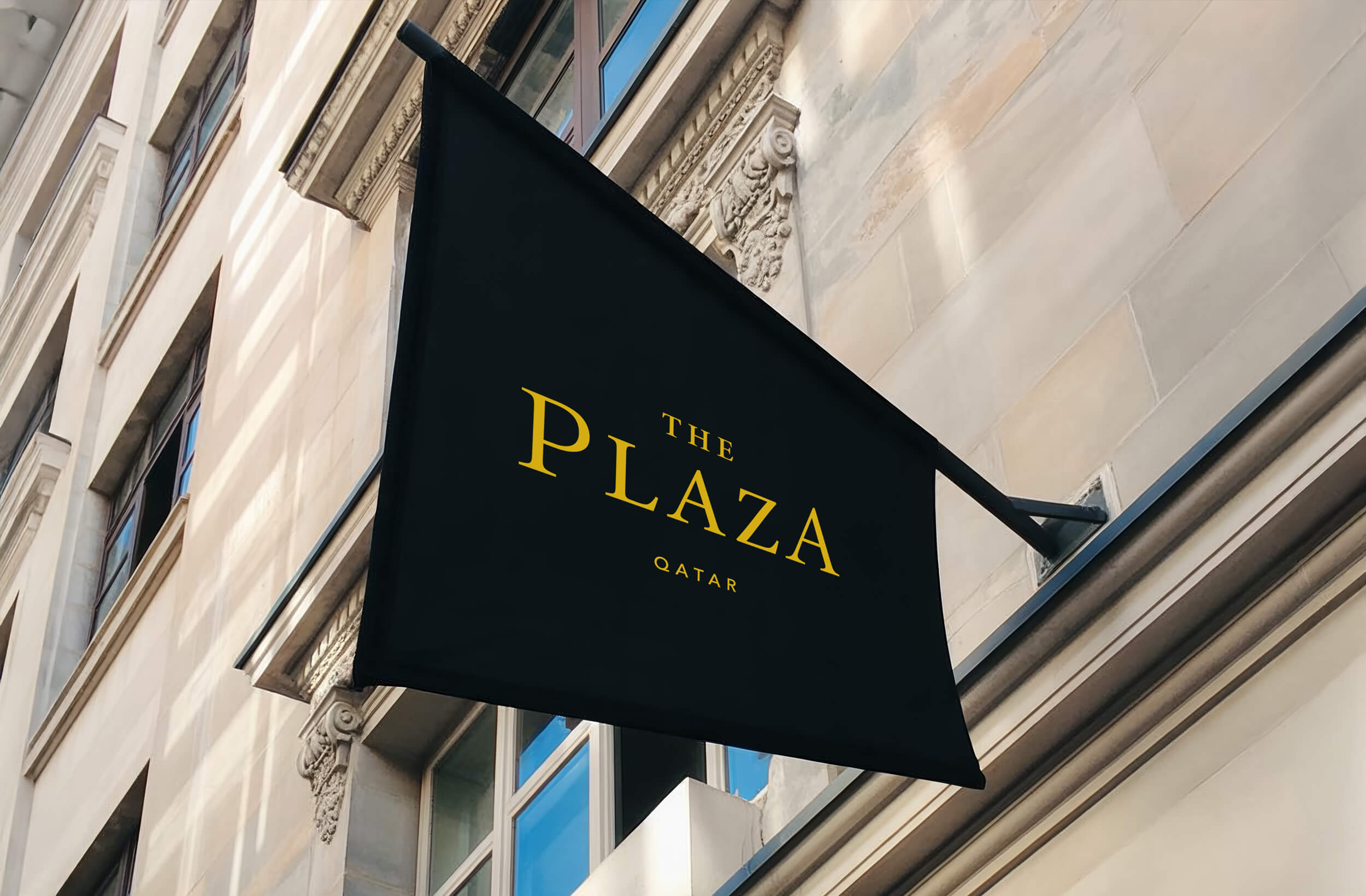 The Plaza hanging banner, side of building